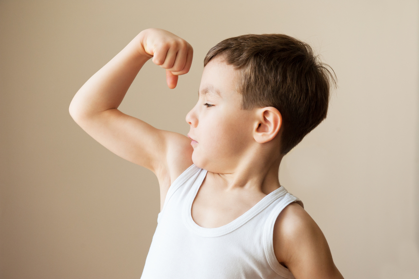 boy showing muscular biceps